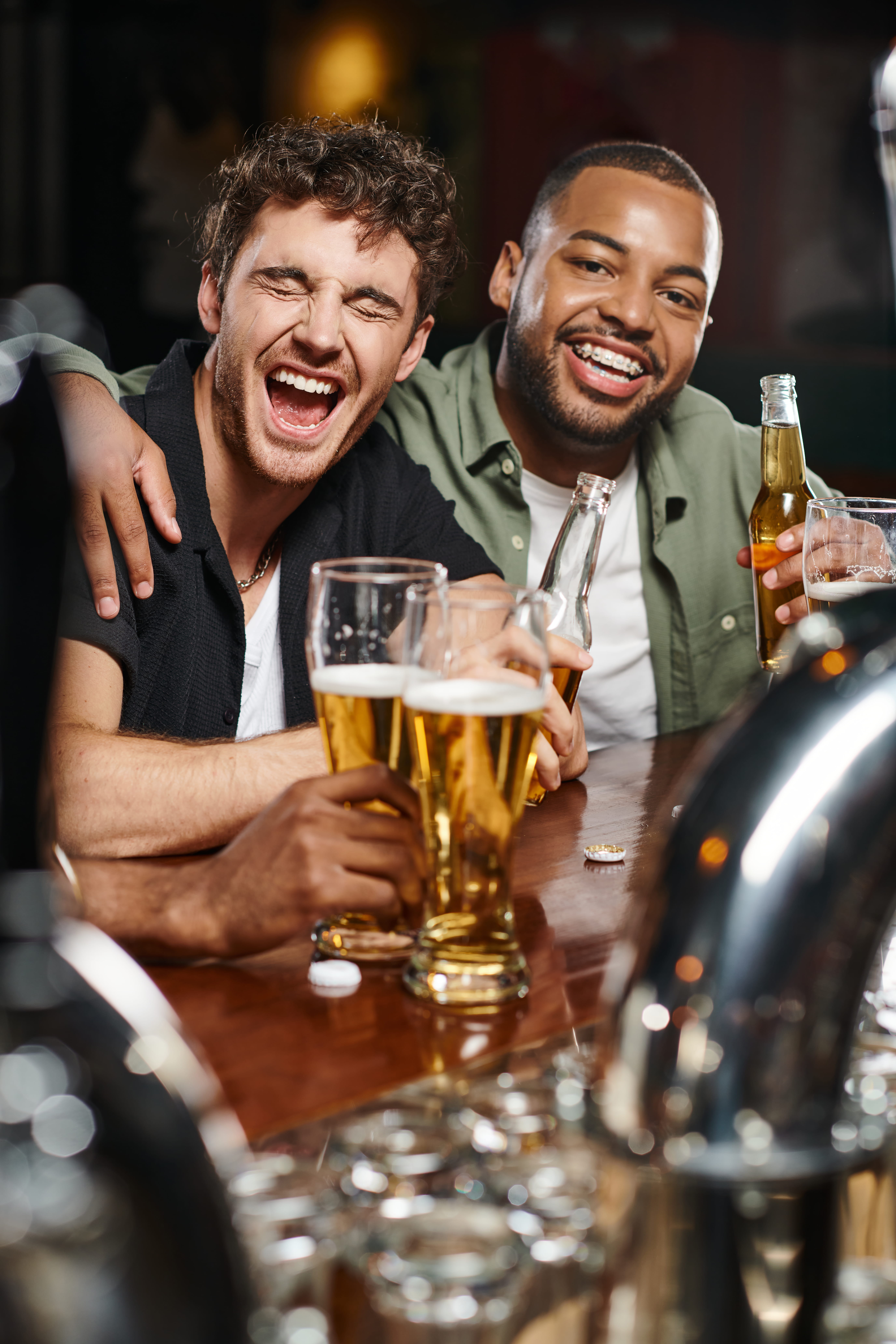 Friends hugging and celebrating on a night out